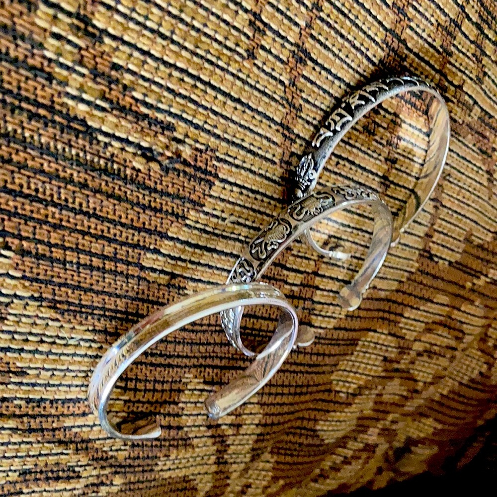 Set of 925 silver bracelets.  Pretty designs. Small to medium wrist.